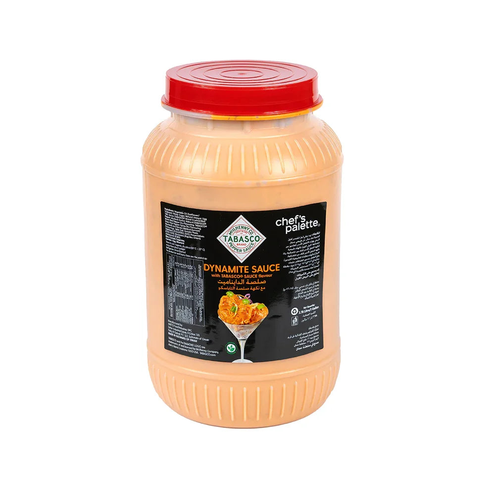 A plastic jar of Tabasco Dynamite Sauce with a red lid, labeled 'CHEF'S PALETTE' and 'Tabasco Dynamite Sauce'. The sauce is displayed with a visual of a chef's toque and a glass of sauce.